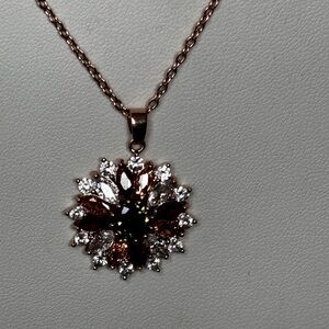 Flower pendant necklace with red, green, clear crystal stones/ gold tone